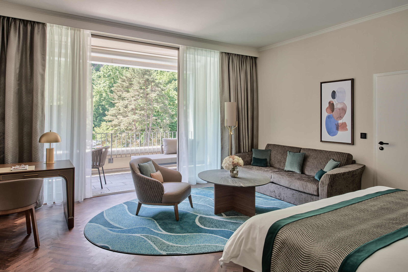 View towards the windows of the living area of a Grand Deluxe Room at the Grand Hotel Hof Ragaz.