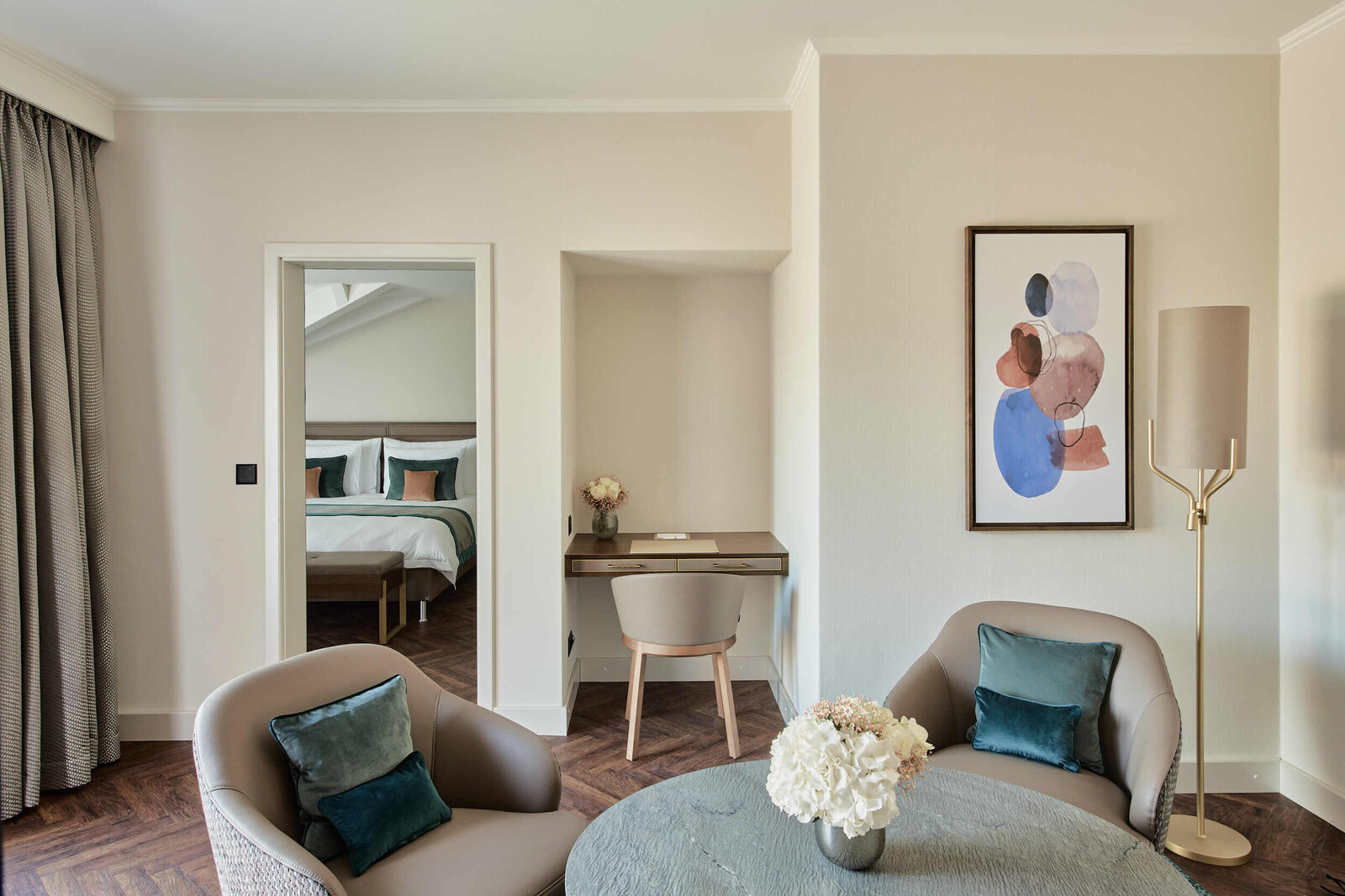The living area including desk and seating area connecting the two bedrooms of the Two Bedroom Suite.