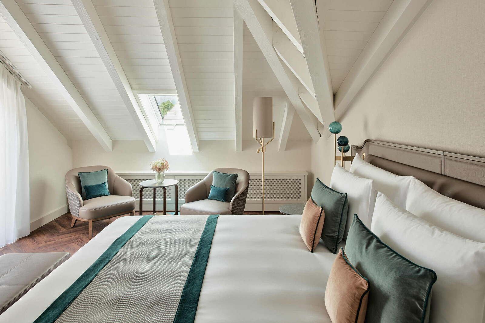 View of one of the double beds in a Two Bedroom Suite at the Grand Hotel Hof Ragaz.