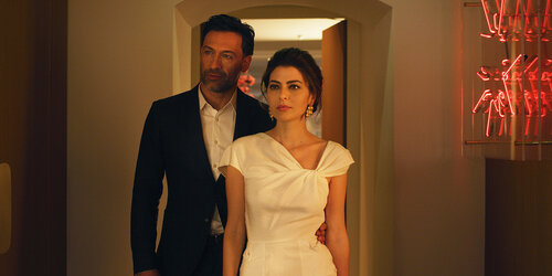 Festively dressed couple enter the restaurant Igniv in Bad Ragaz