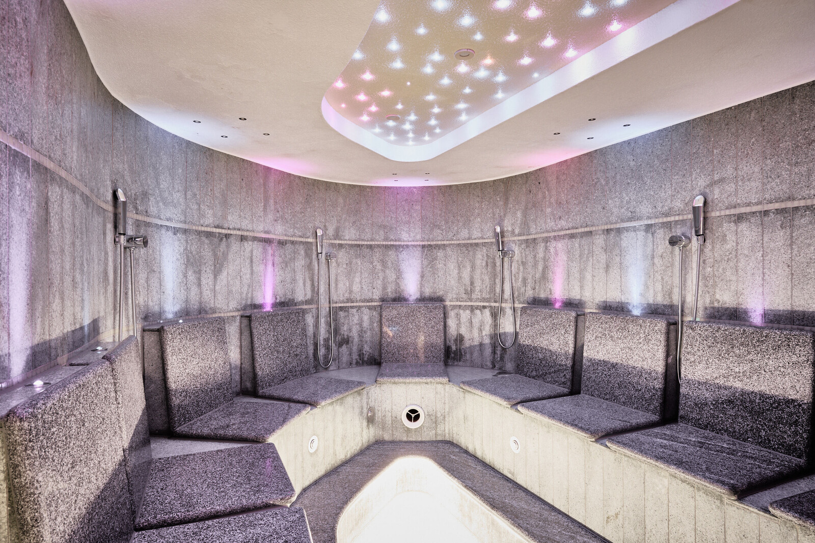 Cozy and modern steam bath with LED lights on the ceiling.