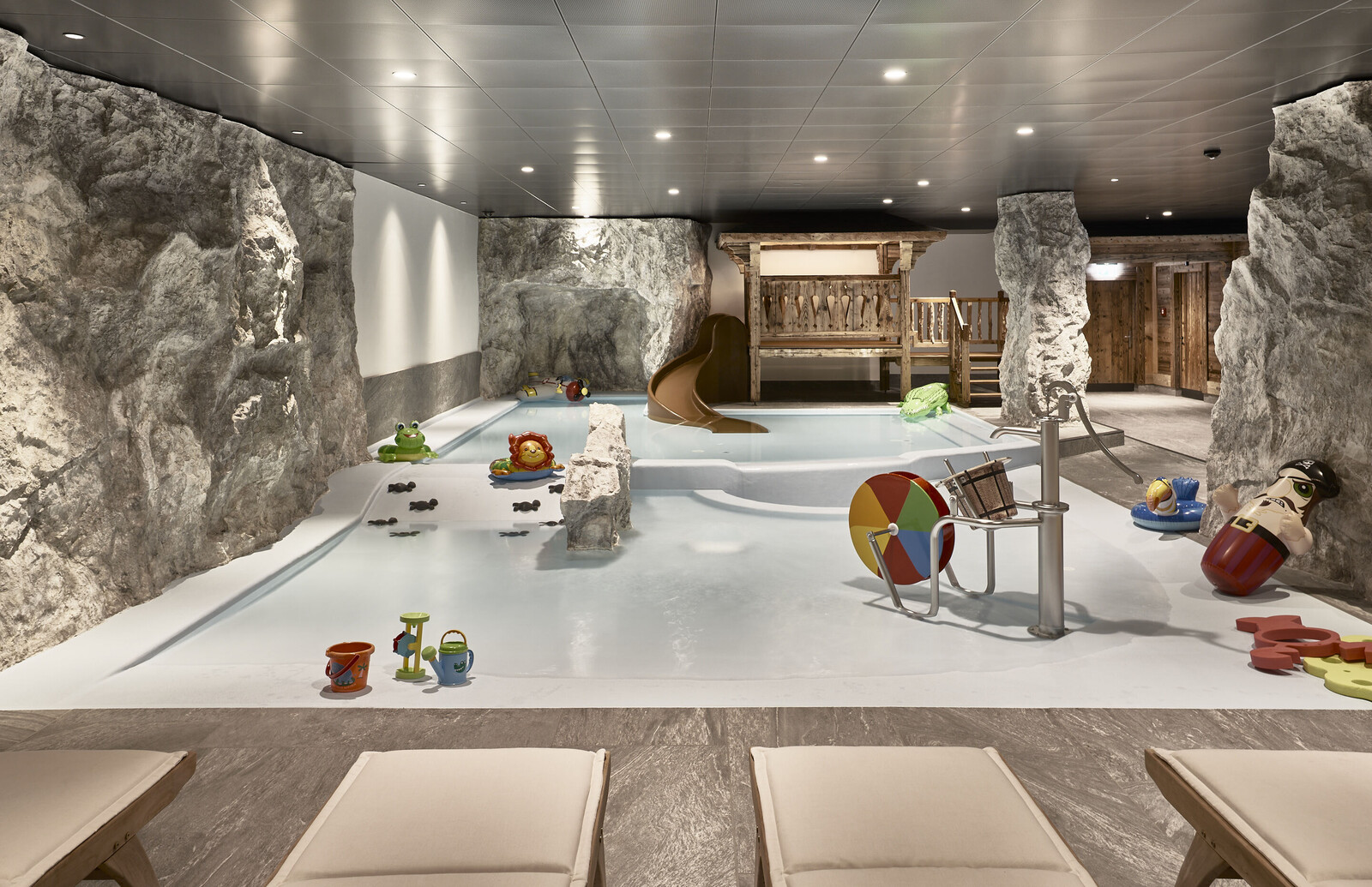 Family-friendly indoor pool with colorful toys at the Grand Resort Bad Ragaz.