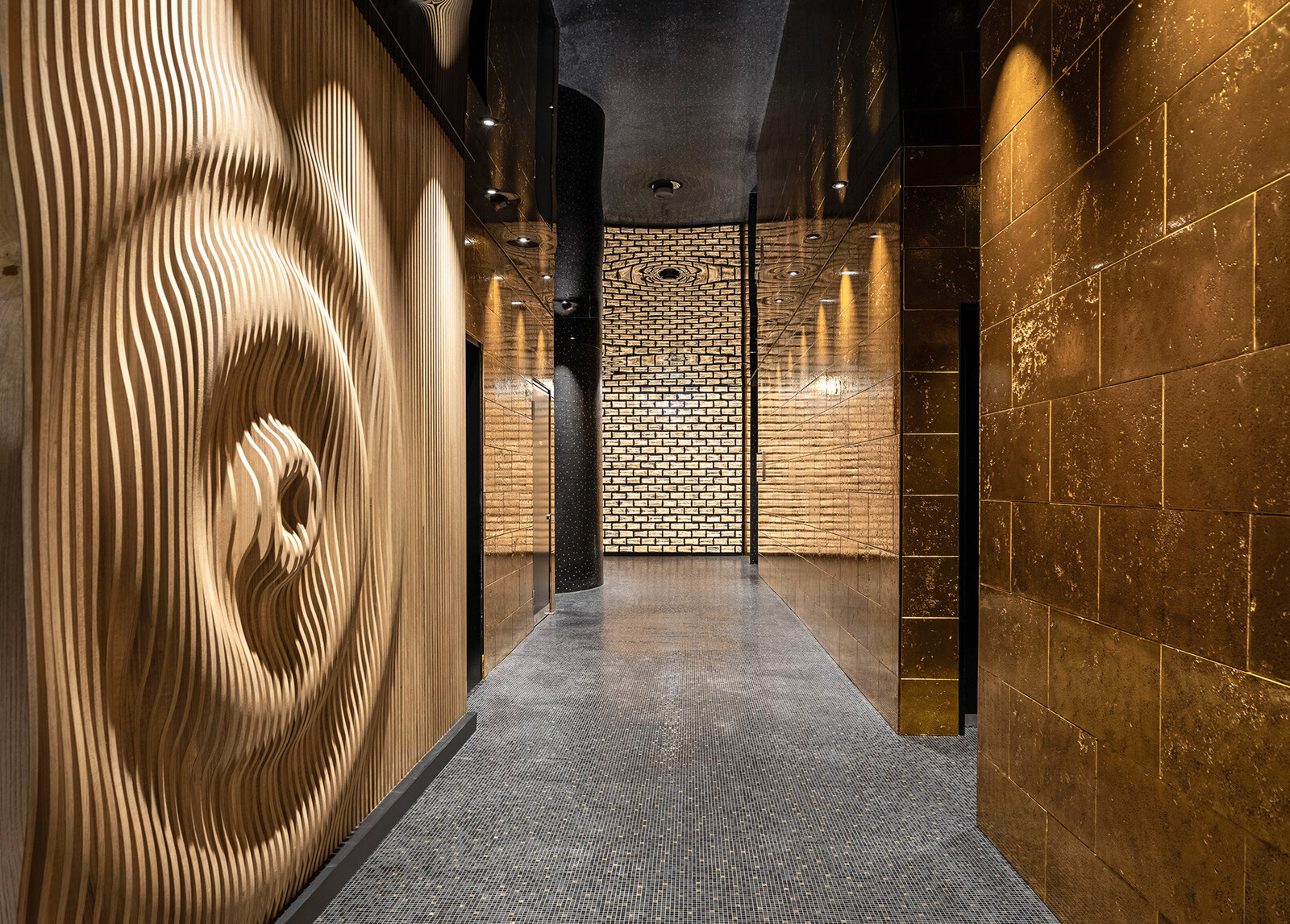 Hallway in the sauna world with golden walls and wooden decorations