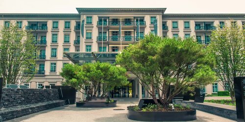 The Hotel Grand Resort Bad Ragaz, a superior luxury resort in Switzerland, is shown with its restaurants and other benefits.